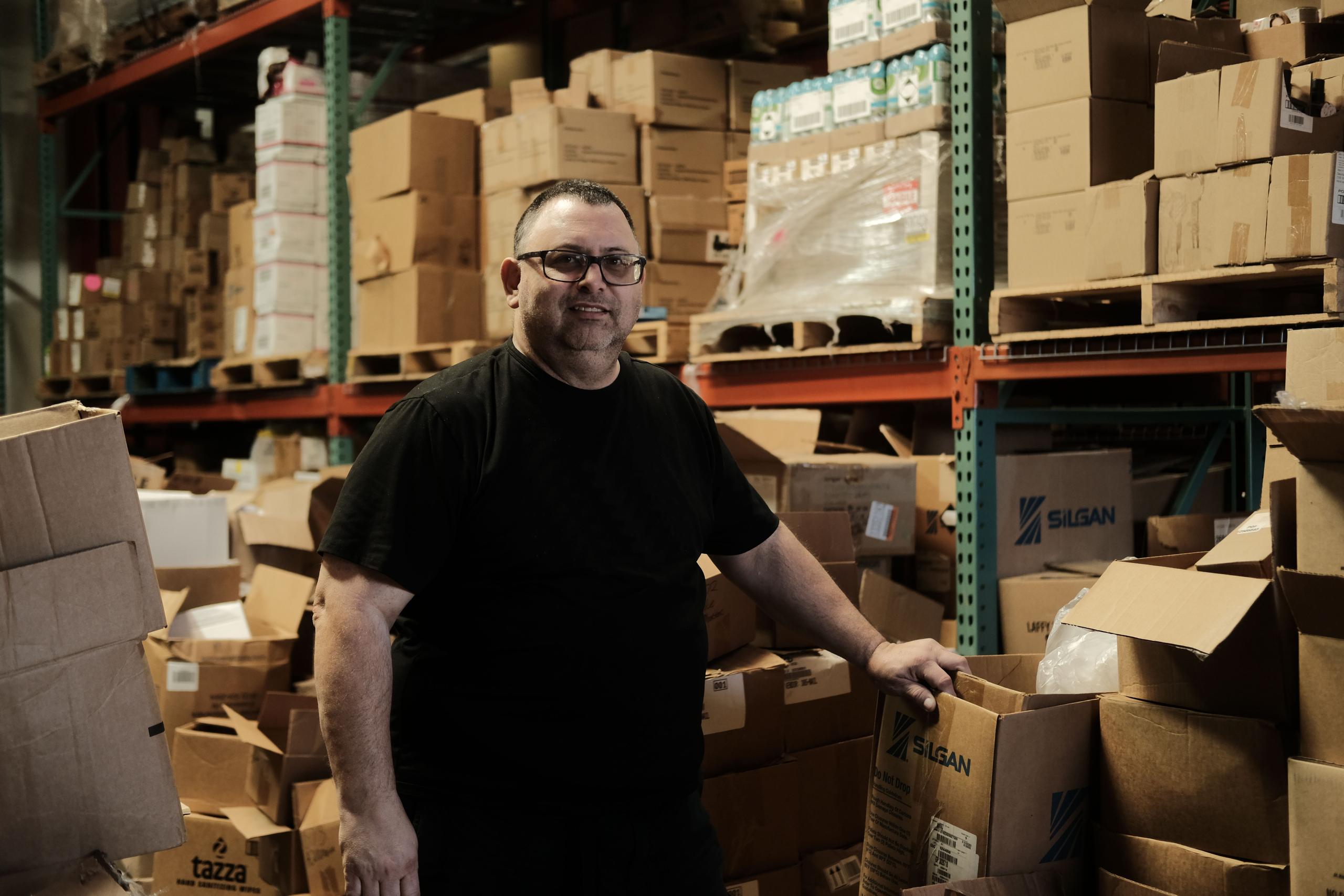 Mike Truffa, founder of A1 Great Deals, stands in his warehouse